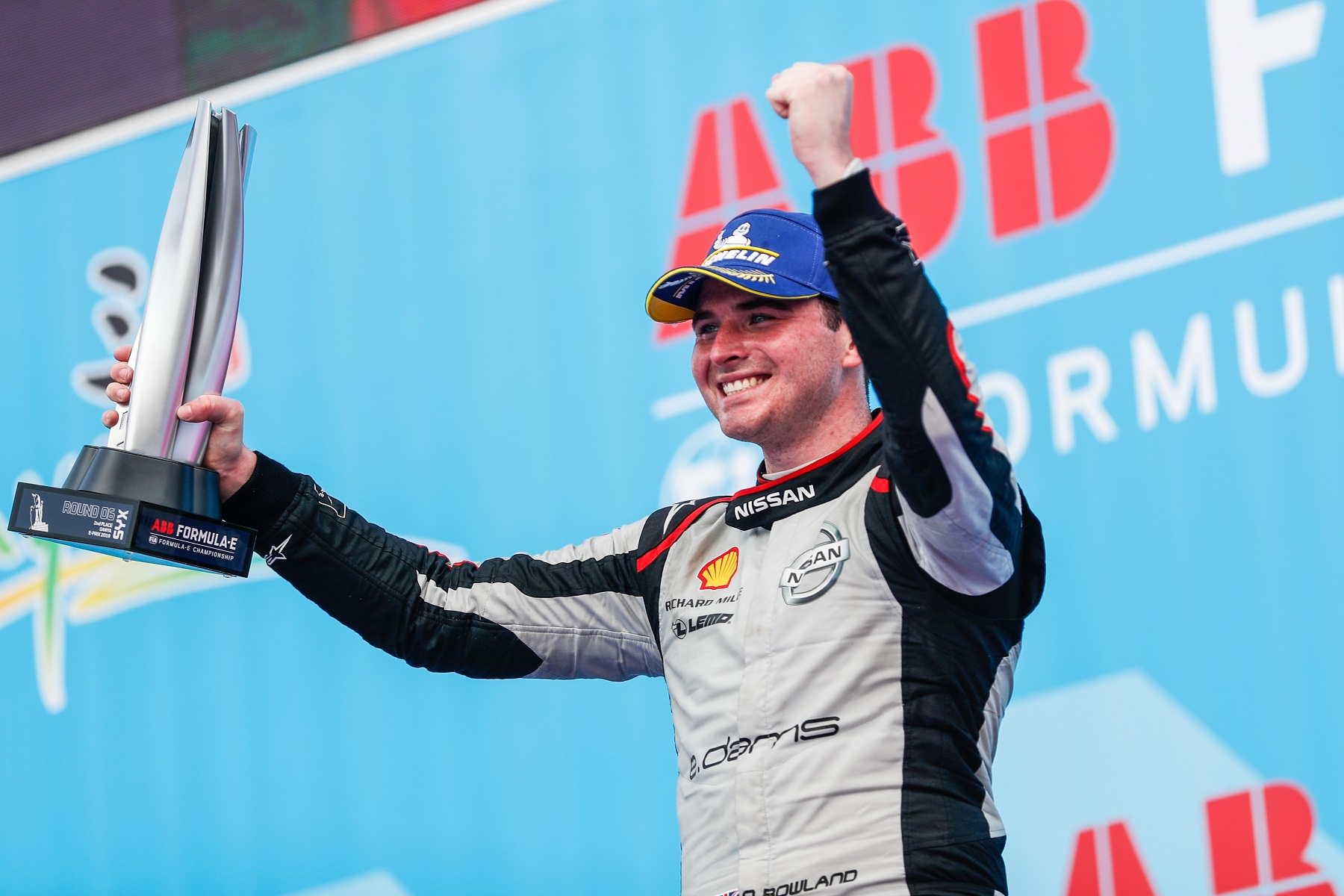 Nissan-e.dams-driver-Oliver-Rowland-with-trophy-on-podium-in-Sanya
